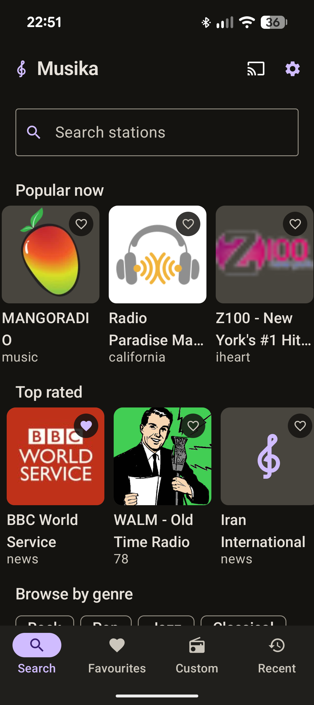 The Musika Search tab, showing a search box above rows of station
                      artwork under Popular now and Top rated, and a Browse by genre list.